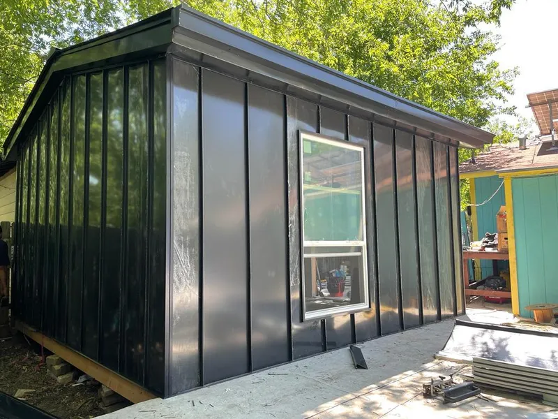 Black standing seam metal wall panels for Roof Inspection in Rockwall