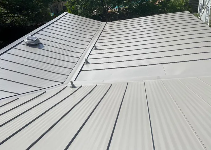 Solar attic fan installed on a metal roof for Roof Ventilation in Rockwall
